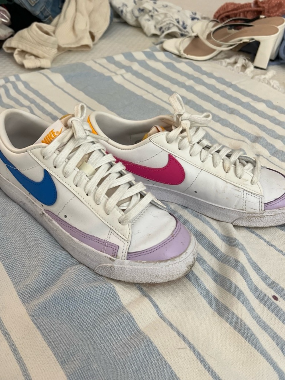 Nike White Low-Top Sneakers with Blue & Pink Swooshes and Lavender Toe